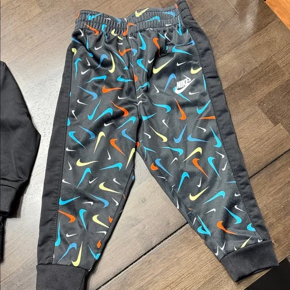 Nike Kids' Black Tracksuit with Vibrant Swooshes - Picture 5 of 7